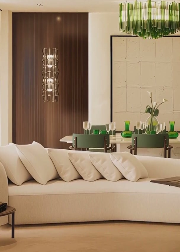 The residents' lounge: low sofas, dining table and green Murano glass pendants.