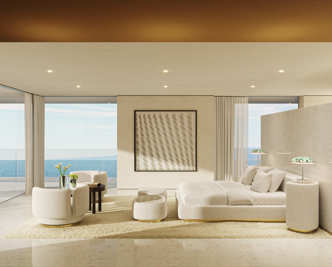 A bedroom in cream, opening to the sea.