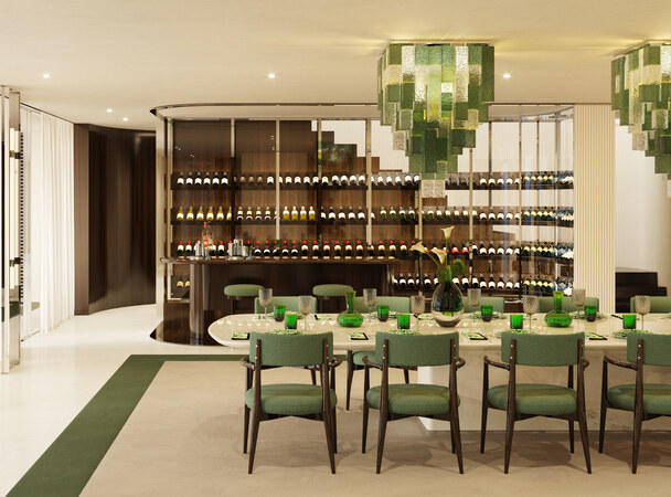 The dining room: green chairs beneath Murano chandeliers.